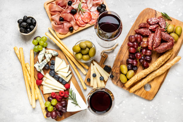 Spanish tapas treats including cold meat, wine, bread and olives